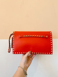 Clutch vermelha spikes Valentino